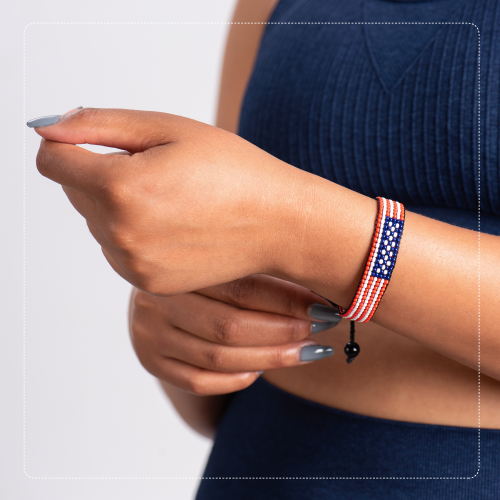 USA flag bracelet worn with a navy outfit